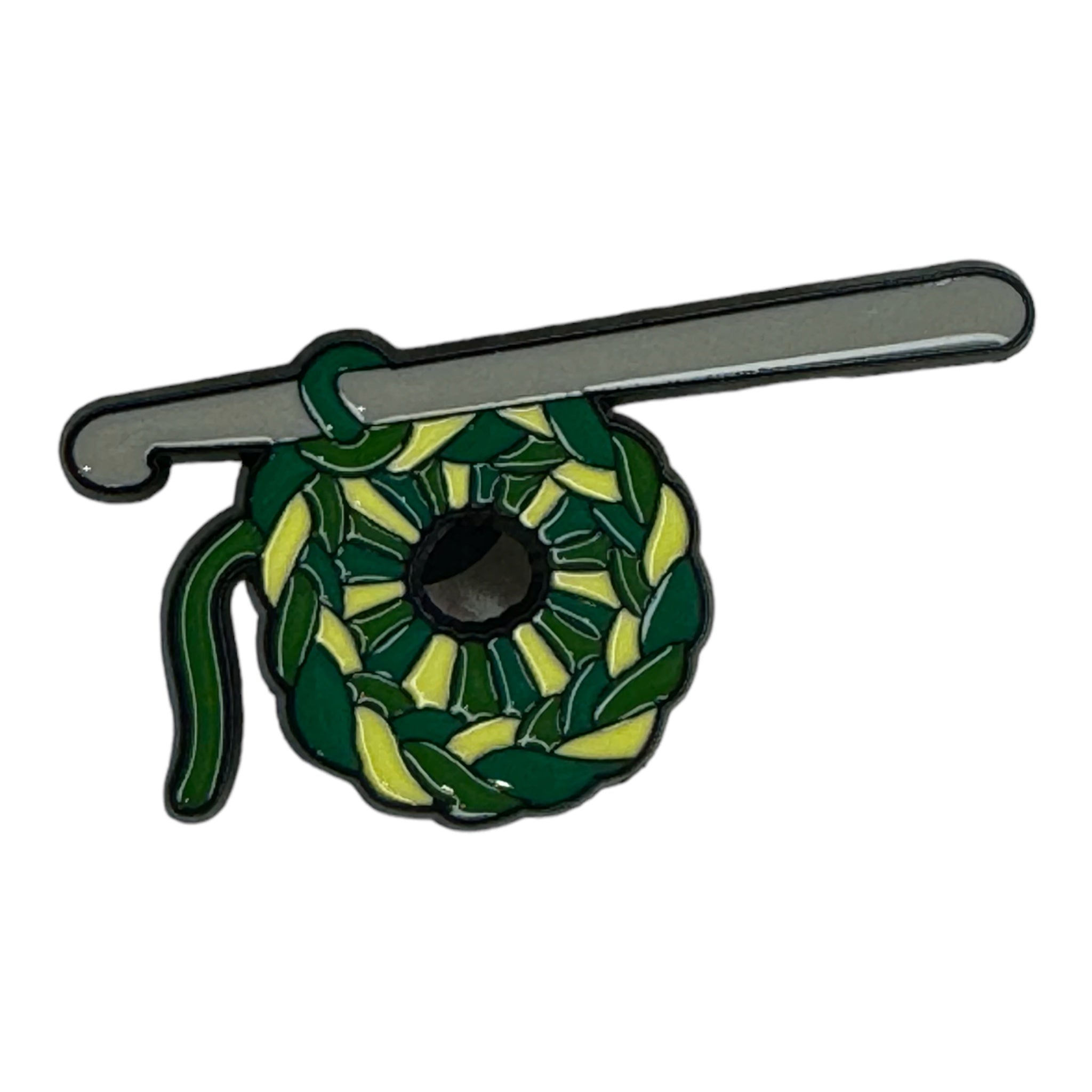 Pin crochet hook with green yarn